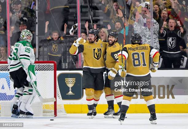 Mark Stone, Chandler Stephenson and Jonathan Marchessault of the Vegas Golden Knights celebrate after Stephenson and Marchessault assisted Stone on a...