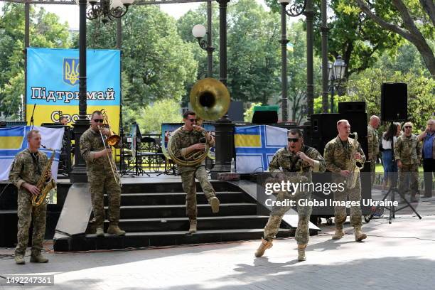 The brass band “Good evening” perform in the City Garden on May 20, 2023 in Odesa, Ukraine. A concert dedicated to the Day of the Ukrainian Marines...