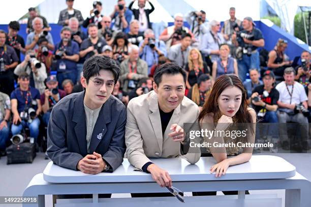 Haoran Liu, Director Anthony Chen and Dongyu Zhou attend the "Ran Dong " photocall at the 76th annual Cannes film festival at Palais des Festivals on...