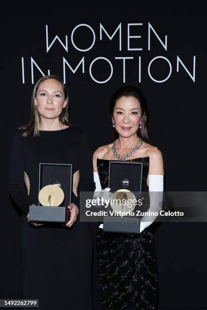 Carmen Jacquier and Michelle Yeoh pose with the Women in Motion Award during the annual Kering "Women in Motion" awards dinner at Place de la Castre...