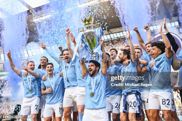 Manchester City captain Ilkay Gundogan lifts the Premier League trophy after the Premier League match between Manchester City and Chelsea FC at...