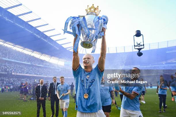 Erling Haaland of Manchester City celebrates with the Premier League trophy after the Premier League match between Manchester City and Chelsea FC at...