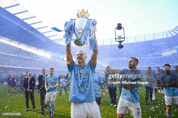 Erling Haaland of Manchester City celebrates with the Premier League trophy after the Premier League match between Manchester City and Chelsea FC at...