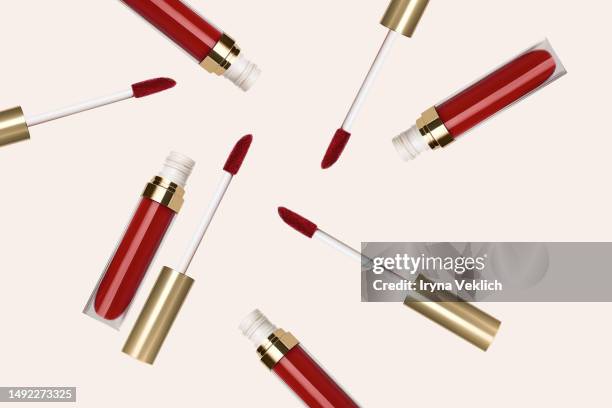 pattern made of  red long wear liquid lipstick on  pastel pink color background. - pink lipstick smear stock pictures, royalty-free photos & images