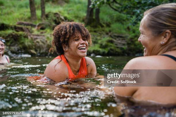 moments in the river - people swim river stockfoto's en -beelden