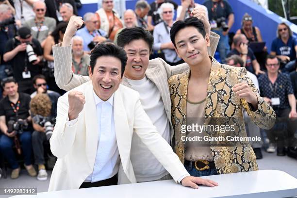 Lee Sun-kyun, Kim Hee-won and Ju Ji-hun attend the "Project Silence" photocall at the 76th annual Cannes film festival at Palais des Festivals on May...