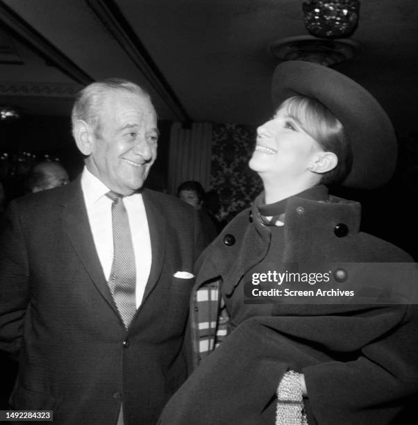 Barbra Streisand sharing a laugh with her 'Funny Girl' director William Wyler, circa 1968.