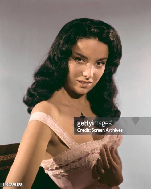 Linda Cristal color image of the Argentinian actress in an early glamour portrait photo shoot.