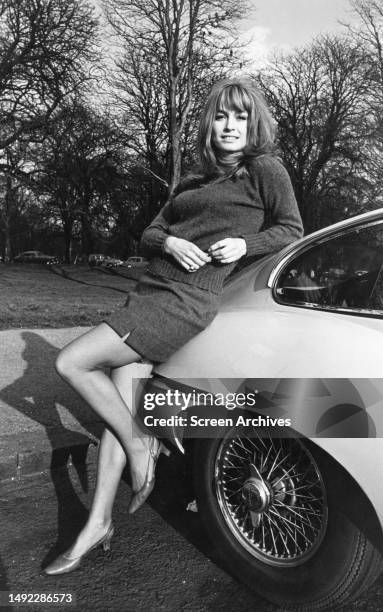 Suzy Kendall leggy 1960's glamour pose by sports car ,, circa To Sir With Love era.