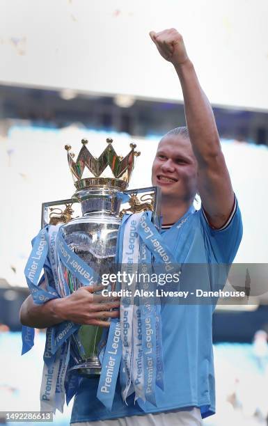 Erling Haaland of Manchester City celebrates with the Premier League trophy after the Premier League match between Manchester City and Chelsea FC at...