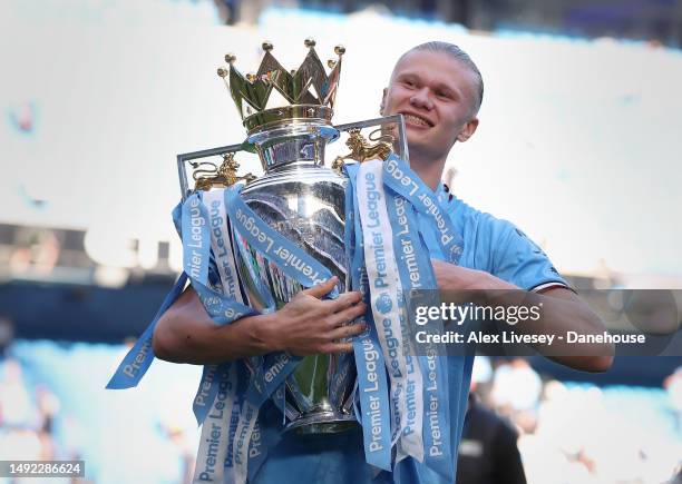 Erling Haaland of Manchester City celebrates with the Premier League trophy after the Premier League match between Manchester City and Chelsea FC at...