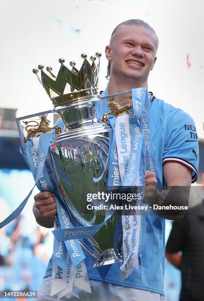 Erling Haaland of Manchester City celebrates with the Premier League trophy after the Premier League match between Manchester City and Chelsea FC at...