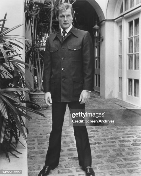 Roger Moore poses in suit as James Bond 007 for the 1973 movie 'Live and Let Die'.