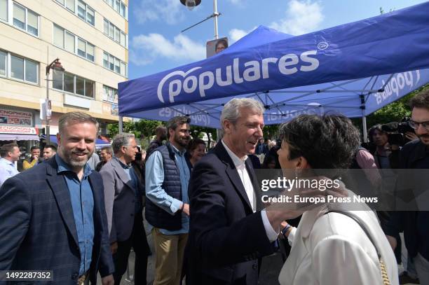 The president of the PPdeG, Alfonso Rueda , greets a woman during a tour of the town center, on 22 May, 2023 in Carballo, A Coruña, Galicia, Spain....