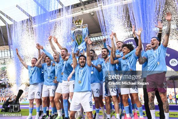 Manchester City captain Ilkay Gundogan lifts the Premier League trophy after the Premier League match between Manchester City and Chelsea FC at...