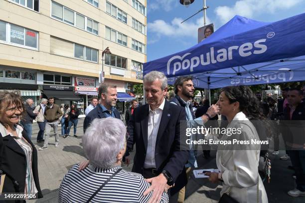 The president of the PPdeG, Alfonso Rueda, greets a woman during a tour of the town center, on 22 May, 2023 in Carballo, A Coruña, Galicia, Spain....