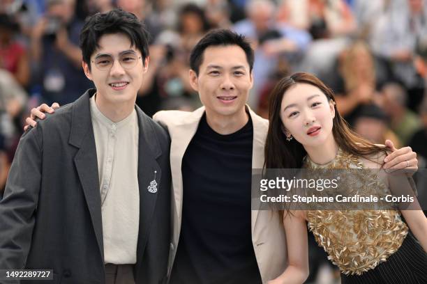 Haoran Liu, Director Anthony Chen and Dongyu Zhou attend the "Ran Dong " photocall at the 76th annual Cannes film festival at Palais des Festivals on...