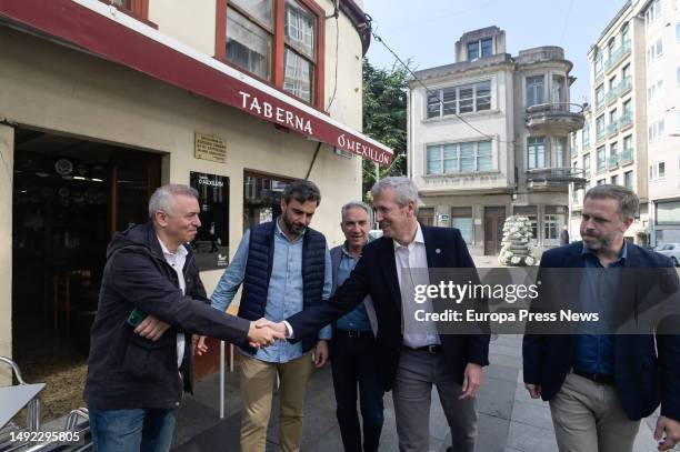 The president of the PPdeG, Alfonso Rueda , greets a man during a tour of the town center, on 22 May, 2023 in Carballo, A Coruña, Galicia, Spain....