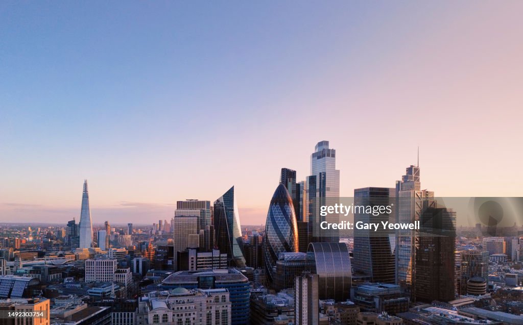 Elevated view over city of London skyline at sunset