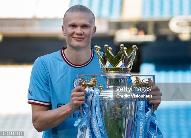 Erling Haaland of Manchester City with the Premier League trophy after the Premier League match between Manchester City and Chelsea FC at Etihad...