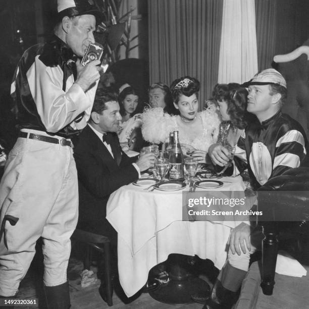 Ava Gardner and Van Heflin in fancy dress at the Hollywood Press Photographers Ball circa, 1950.