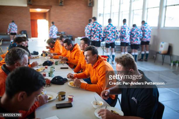 Members of the Orania Rugby team eat breakfast before a game on April 29 in Orania, South Africa. Several teams visited Orania to be part of the...