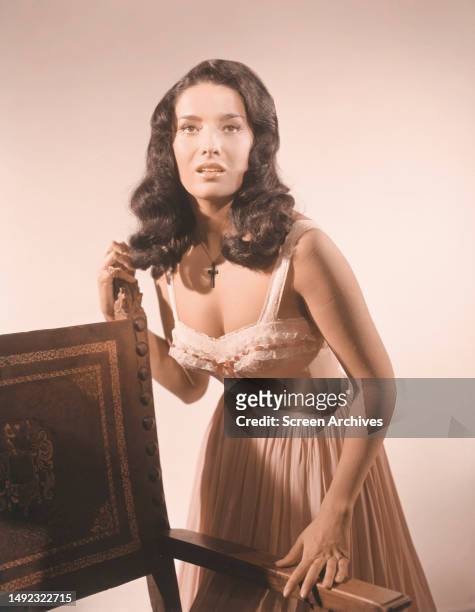Linda Cristal Photo shoot color in low cut dress, 1950s.