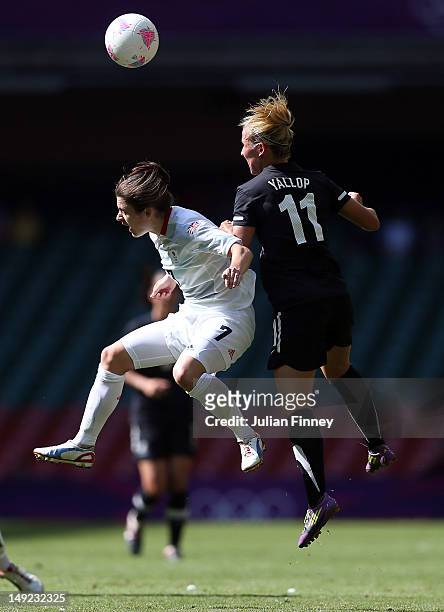 Karen Carney of Great Britain challenges in the air with Kirsty Yallop of New Zealand during the Women's Football first round Group E Match of the...