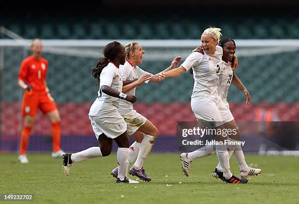 Stephanie Houghton of Great Britain is congratulated by team mates Kelly Smith of Great Britain, Eniola Aluko of Great Britain and Ifeoma Dieke of...