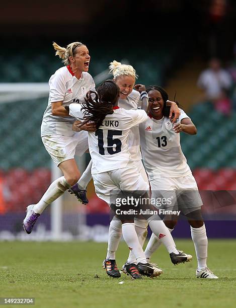 Stephanie Houghton of Great Britain is congratulted by team mates Kelly Smith of Great Britain, Eniola Aluko of Great Britain and Ifeoma Dieke of...