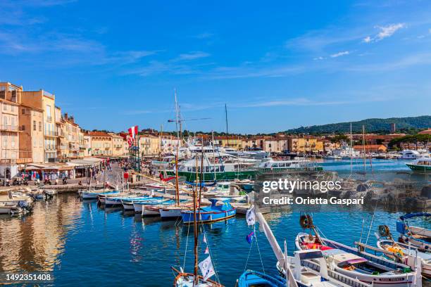 yachts moored at the port of saint-tropez - france - townscape stock pictures, royalty-free photos & images