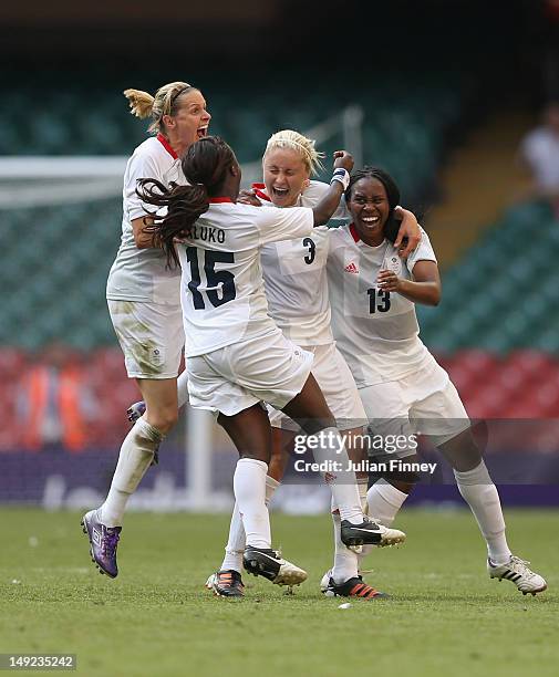 Stephanie Houghton of Great Britain is congratulated by team mates Kelly Smith of Great Britain, Eniola Aluko of Great Britain and Ifeoma Dieke of...