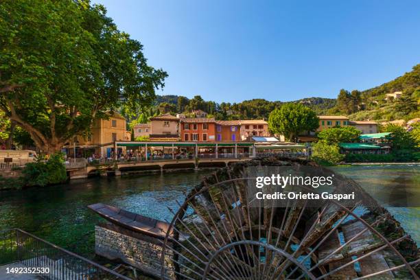 nature and history in fontaine-de-vaucluse, a charming village in southern france - vaucluse stock pictures, royalty-free photos & images