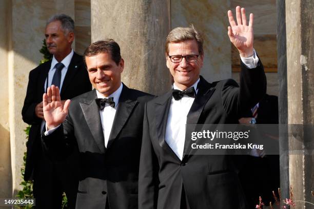 Michael Mronz and Guido Westerwelle arrive for the Bayreuth festival 2012 premiere on July 25, 2012 in Bayreuth, Germany.