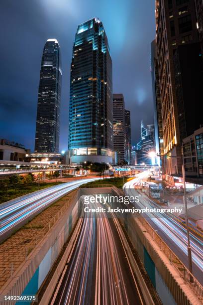 hong kong traffic at night - performance car stock pictures, royalty-free photos & images