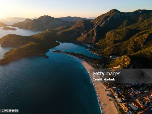 mesmerizing beach getaway: a serene aerial snapshot of a beautiful paradise beach - ölüdeniz stock pictures, royalty-free photos & images