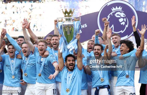 Ilkay Guendogan of Manchester City lifts the Premier League trophy following the Premier League match between Manchester City and Chelsea FC at...