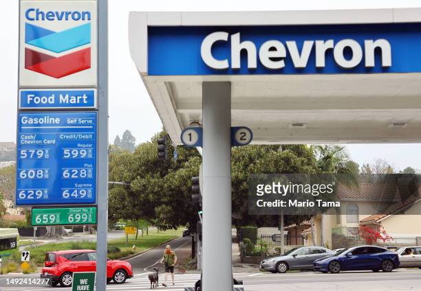 The Chevron logo is displayed at a Chevron gas station on May 22, 2023 in Los Angeles, California. Chevron is doubling down in the shale sector with...
