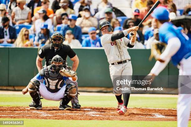 wide shot batter watching hit during at-bat in baseball game - referee shirt stock pictures, royalty-free photos & images