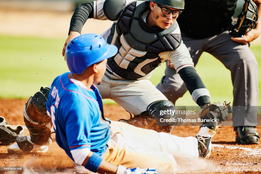 Tagging Up Medium Wide Shot Catcher Tagging Sliding Runner During Baseball Game ...