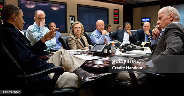 In this photo provided by The White House, President Barack Obama,National Security Advisor Tom Donilon, Secretary of State Hillary Clinton, Director...