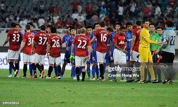 Players of Manchester United shake hands with players of Shanghai Shenhua after the Friendly Match between Shanghai Shenhua and Manchester United at...