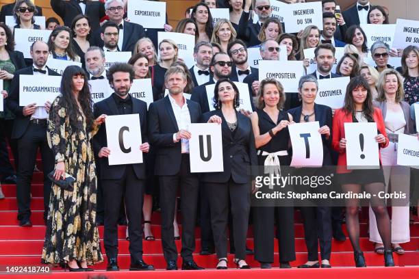 Activists attend the "Club Zero" red carpet during the 76th annual Cannes film festival at Palais des Festivals on May 22, 2023 in Cannes, France.