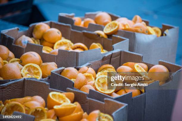 discarded squeezed orange halves - orange peel texture stock pictures, royalty-free photos & images