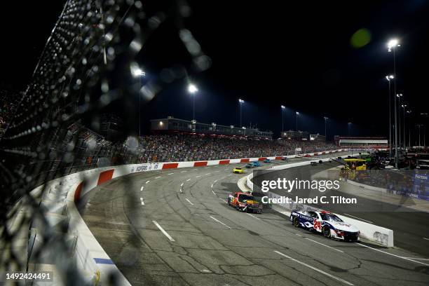 William Byron, driver of the Liberty University Chevrolet, leads a pack of cars during the NASCAR Cup Series All-Star Race at North Wilkesboro...