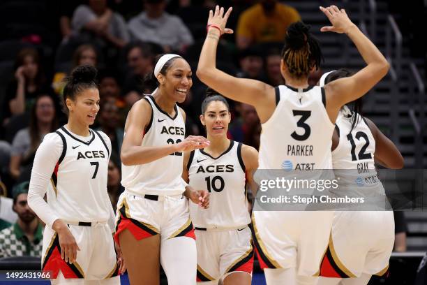 Alysha Clark, A'ja Wilson, Kelsey Plum Candace Parker, and Chelsea Gray of the Las Vegas Aces react after a basket by Wilson during the second...