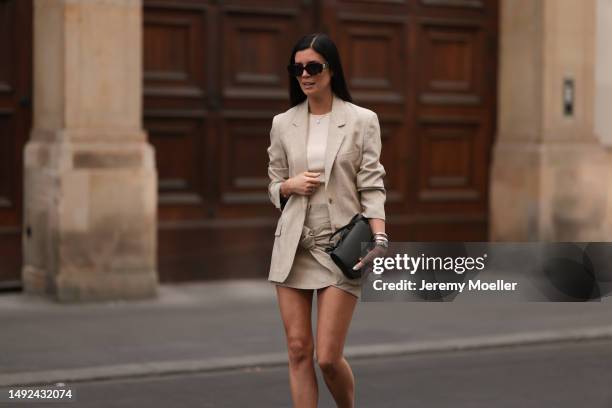 Leo Eberlin seen wearing Zara linen beige long blazer, Zara matching linen flower mini skirt, Celine brown shades, Hermes Constance mini leather bag,...