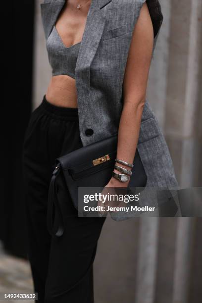 Leo Eberlin seen wearing Hermes Chypre velvet rose sandals, Revolve grey linen bra top and matching Revolve grey linen blazer vest, YSL brown shades,...