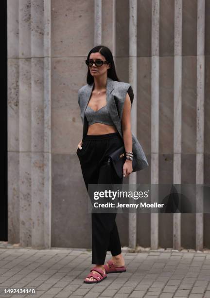 Leo Eberlin seen wearing Hermes Chypre velvet rose sandals, Revolve grey linen bra top and matching Revolve grey linen blazer vest, YSL brown shades,...