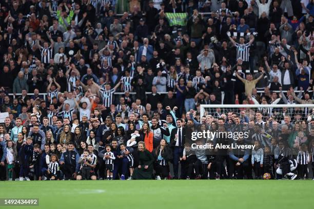 Players, staff and families of Newcastle United pose for a photo after their team qualifies for the UEFA Champions League following the Premier...